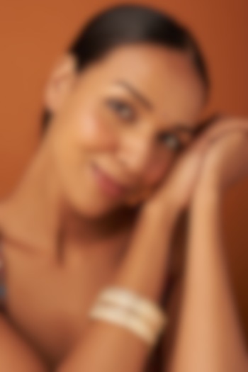 Gold Finish Kundan Polki Bangles (Set of 2) by Vivinia By Vidhi Mehra at Pernia's Pop Up Shop