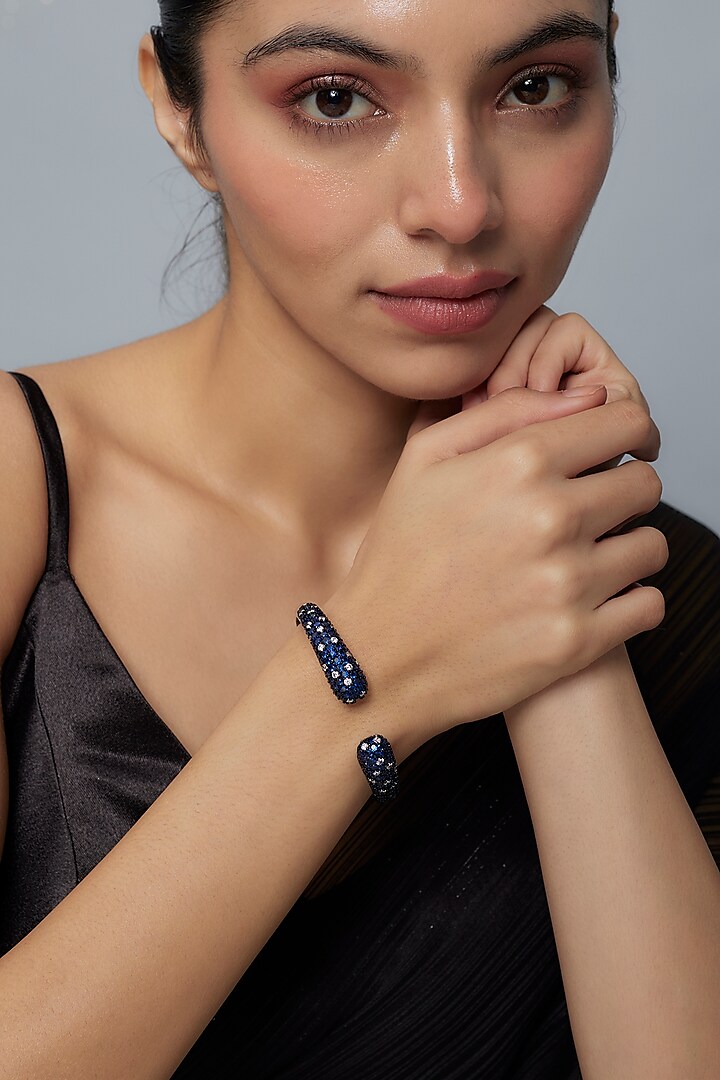 White Finish Blue Zircon Bangle by Vivinia By Vidhi Mehra at Pernia's Pop Up Shop