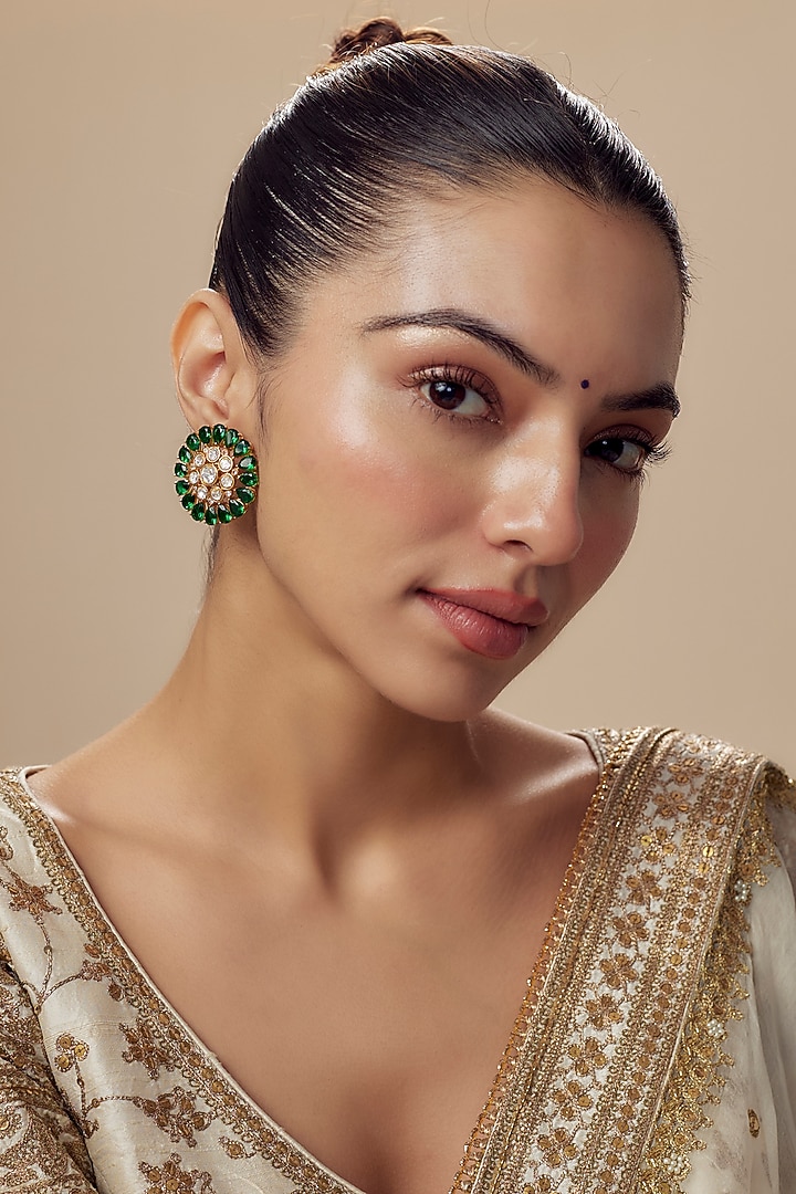 Gold Finish Moissanite Polki & Emerald Green Stone Stud Earrings by Vivinia By Vidhi Mehra at Pernia's Pop Up Shop