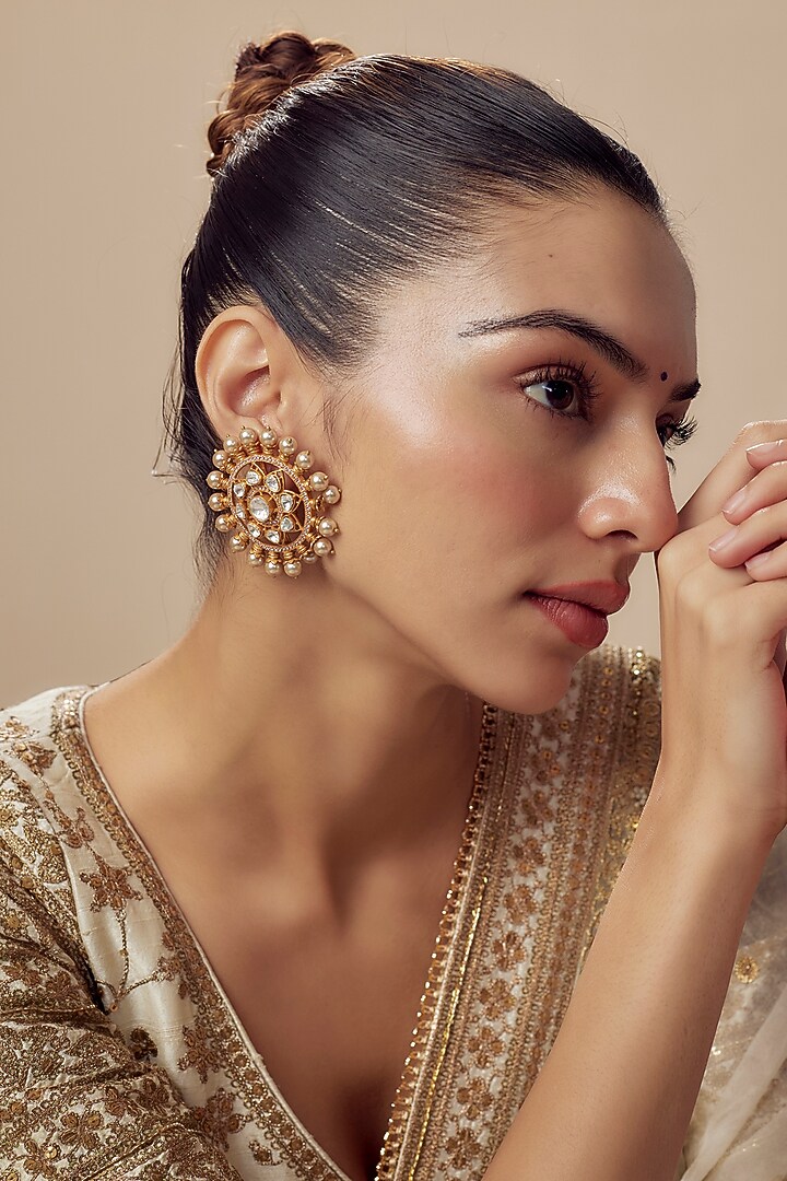 Gold Finish Kundan Polki & Pearl Stud Earrings by Vivinia By Vidhi Mehra at Pernia's Pop Up Shop