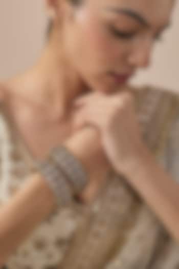 Gold Finish Kundan Polki Bangles (Set Of 2) by Vivinia By Vidhi Mehra at Pernia's Pop Up Shop