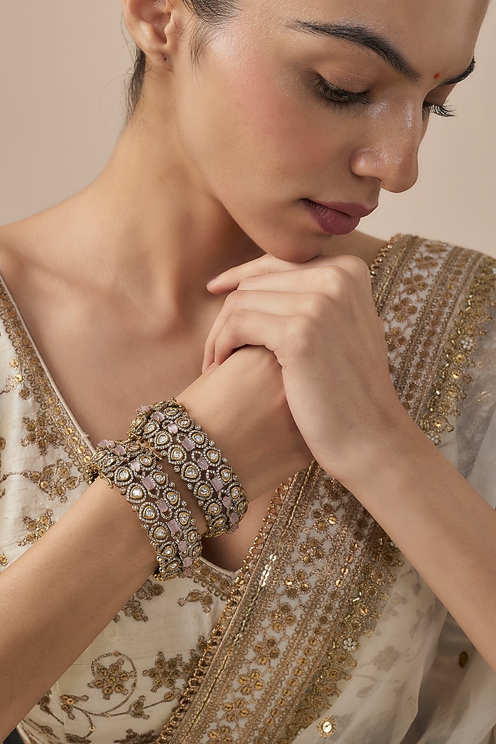 Gold Finish Kundan Polki Bangles (Set Of 2) by Vivinia By Vidhi Mehra at Pernia's Pop Up Shop