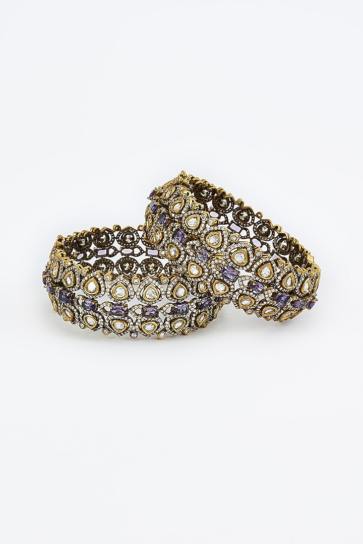 Gold Finish Kundan Polki & Purple Synthetic Stone Bangles (Set Of 2) by Vivinia By Vidhi Mehra at Pernia's Pop Up Shop