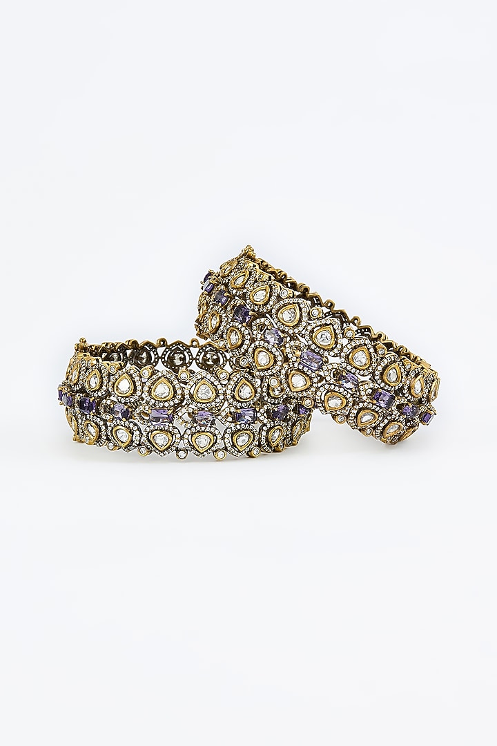 Gold Finish Kundan Polki & Purple Synthetic Stone Bangles (Set Of 2) by Vivinia By Vidhi Mehra at Pernia's Pop Up Shop
