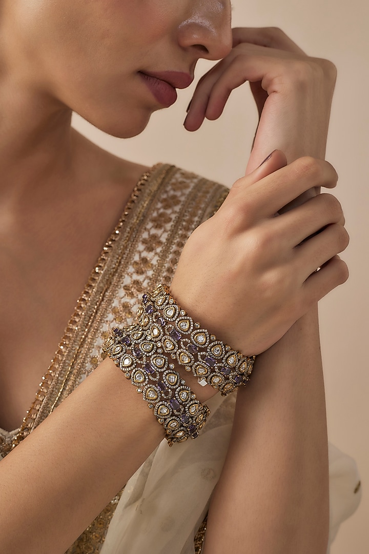 Gold Finish Kundan Polki & Purple Synthetic Stone Bangles (Set Of 2) by Vivinia By Vidhi Mehra at Pernia's Pop Up Shop