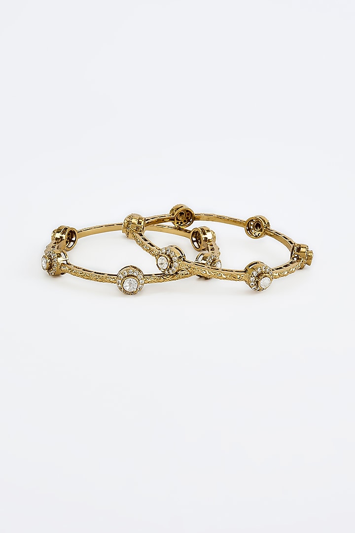 Gold Finish Kundan Polki Bangles (Set Of 2) by Vivinia By Vidhi Mehra at Pernia's Pop Up Shop