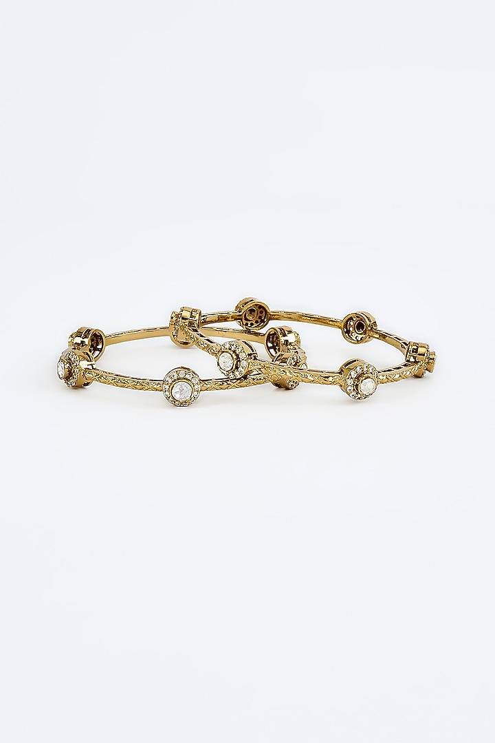 Gold Finish Kundan Polki Bangles (Set Of 2) by Vivinia By Vidhi Mehra at Pernia's Pop Up Shop