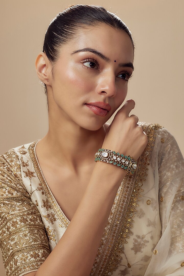 Gold Finish Zircon & Aqua Stone Bangle by Vivinia By Vidhi Mehra at Pernia's Pop Up Shop