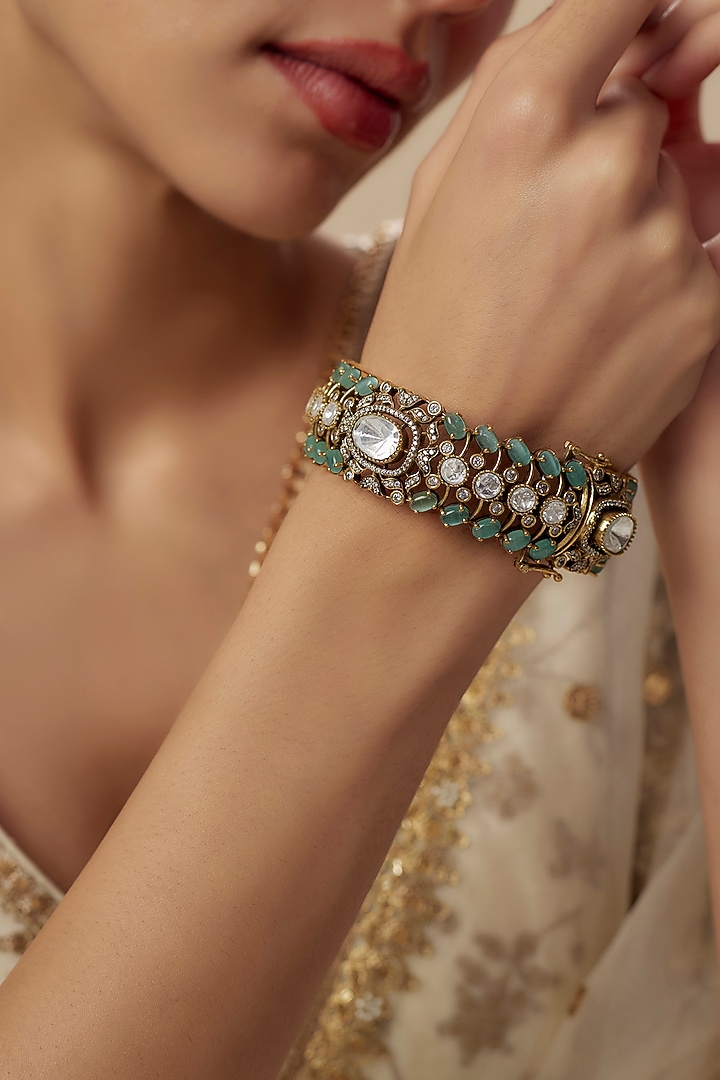 Gold Finish Zircon & Aqua Stone Bangle by Vivinia By Vidhi Mehra at Pernia's Pop Up Shop