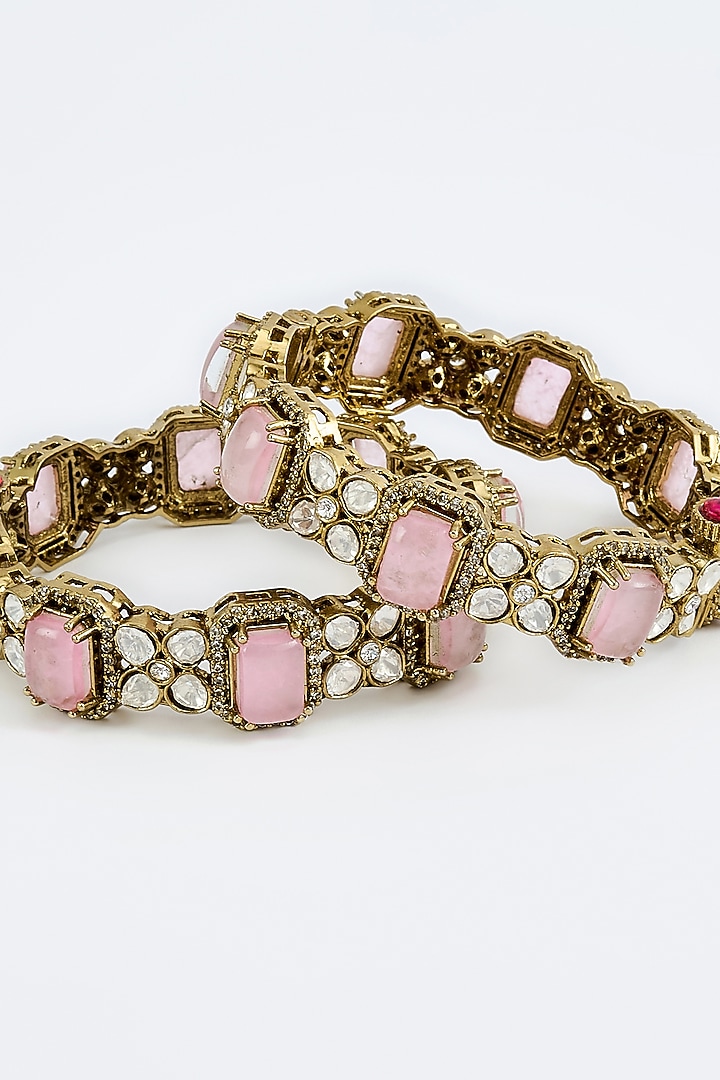 Gold Finish Zircon & Ruby Synthetic Stone Bangles (Set Of 2) by Vivinia By Vidhi Mehra at Pernia's Pop Up Shop