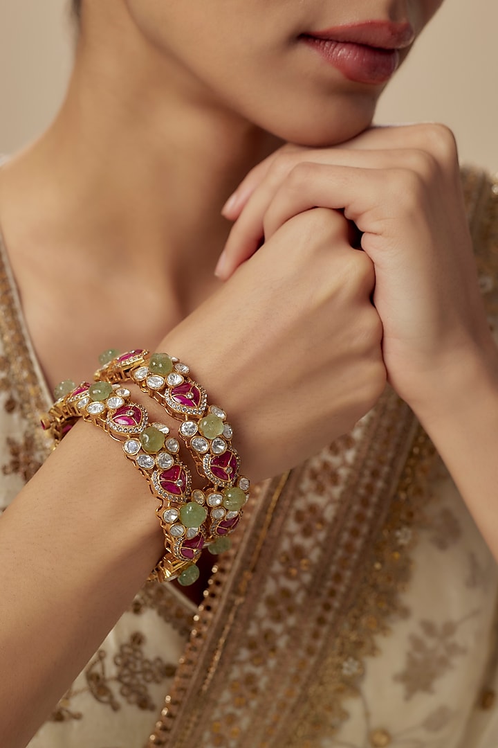 Gold Finish Kundan Polki Bangles (Set Of 2) by Vivinia By Vidhi Mehra at Pernia's Pop Up Shop