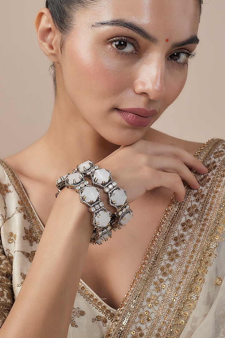 White Finish Zircon Bangles (Set Of 2) by Vivinia By Vidhi Mehra at Pernia's Pop Up Shop