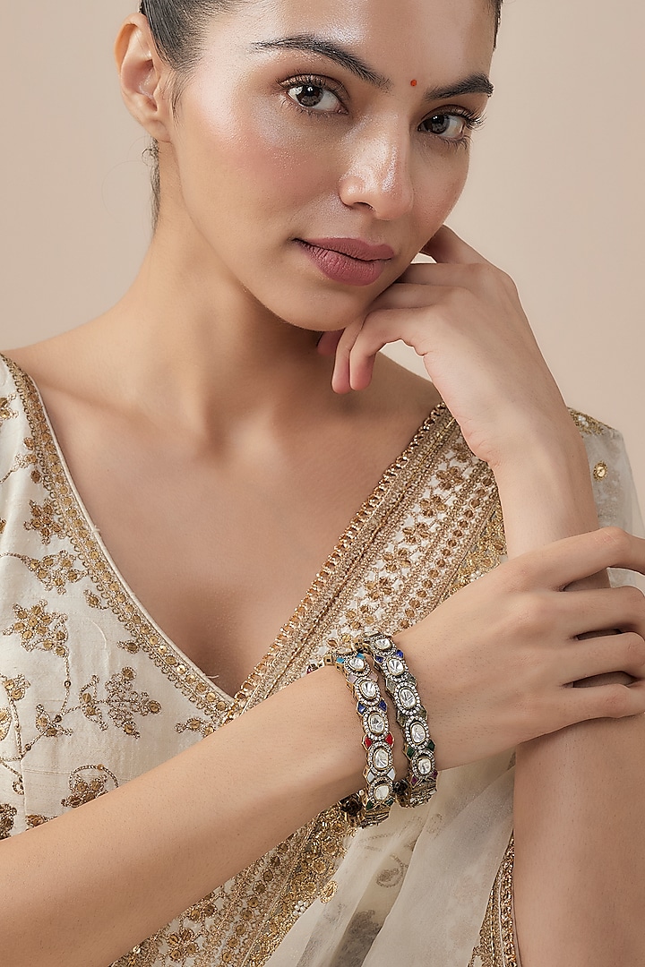 Gold Finish Kundan Polki & Navratna Stone Bangles (Set Of 2) by Vivinia By Vidhi Mehra at Pernia's Pop Up Shop