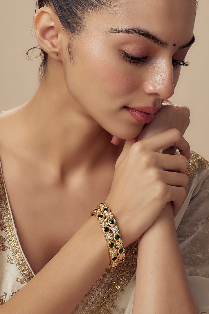 Gold Finish Kundan Polki Bangles (Set Of 2) by Vivinia By Vidhi Mehra at Pernia's Pop Up Shop