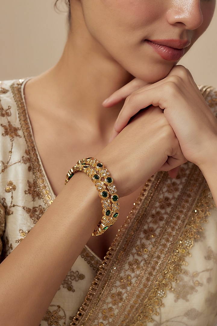 Gold Finish Kundan Polki Bangles (Set Of 2) by Vivinia By Vidhi Mehra at Pernia's Pop Up Shop