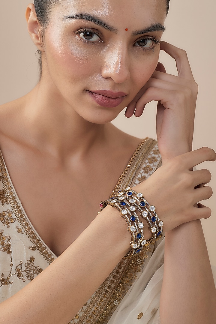 Gold Finish Kundan Polki & Turquoise Stone Bangles (Set Of 2) by Vivinia By Vidhi Mehra at Pernia's Pop Up Shop