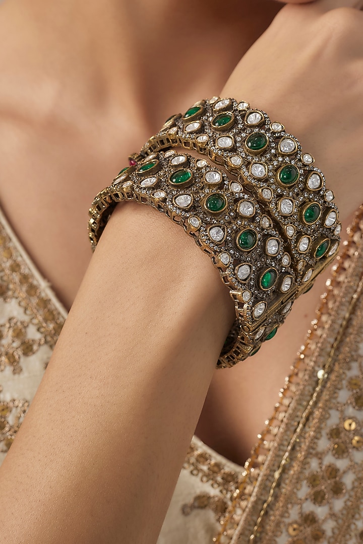 Gold Finish Kundan Polki Green Stone Bangles (Set Of 2) by Vivinia By  Vidhi Mehra at Pernia's Pop Up Shop