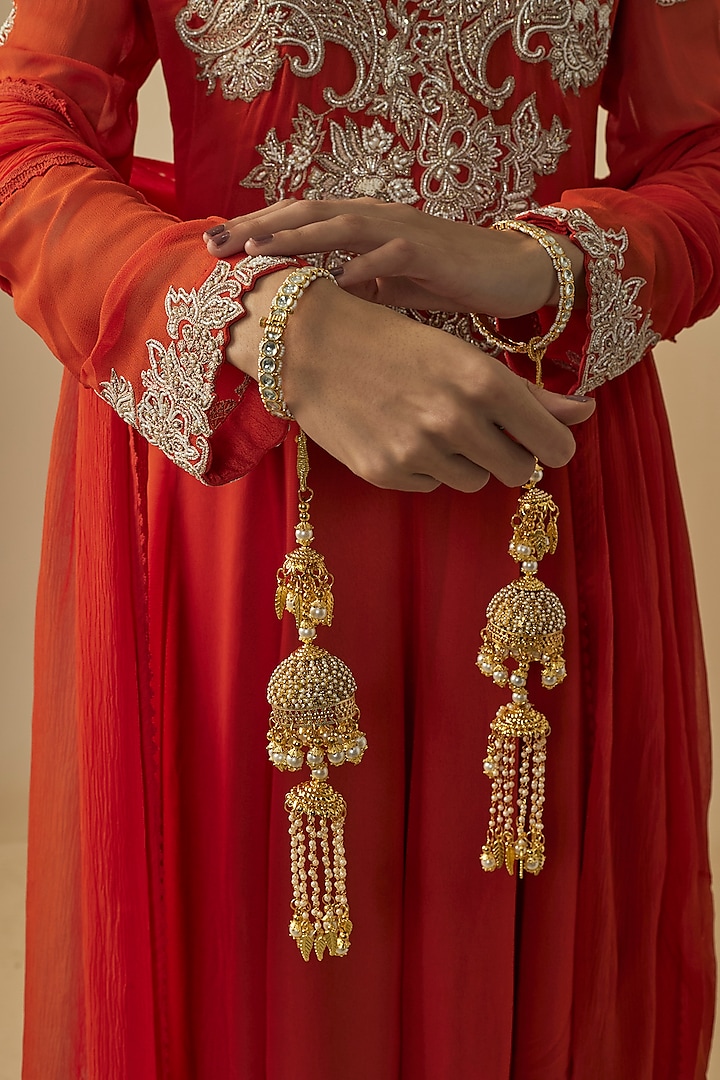 Gold Finish Kundan Polki & Pearl Strand Kaleeras (Set Of 2) by Vivinia By Vidhi Mehra at Pernia's Pop Up Shop