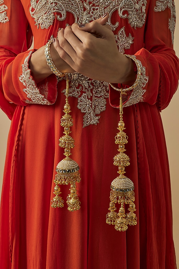 Gold Finish Kundan Polki & Pearl Strand Kaleeras (Set Of 2) by Vivinia By Vidhi Mehra at Pernia's Pop Up Shop