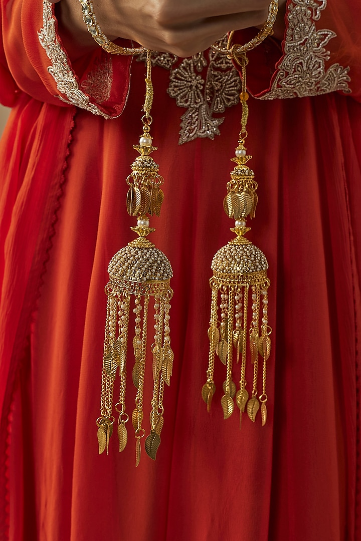 Gold Finish Kundan Polki & Pearl Strand Tying Kaleeras (Set Of 2) by Vivinia By Vidhi Mehra at Pernia's Pop Up Shop