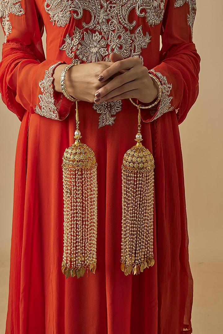 Gold Finish Kundan Polki & Pearl Strand Tying Kaleeras (Set Of 2) by Vivinia By Vidhi Mehra at Pernia's Pop Up Shop