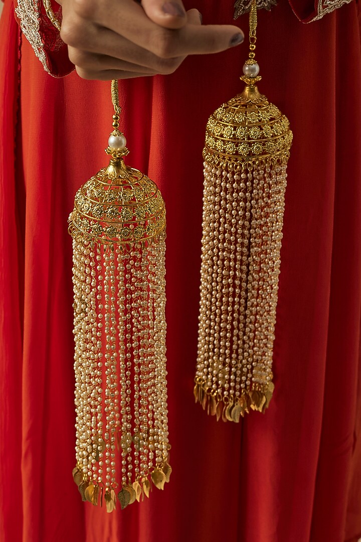 Gold Finish Kundan Polki & Pearl Strand Tying Kaleeras (Set Of 2) by Vivinia By Vidhi Mehra at Pernia's Pop Up Shop