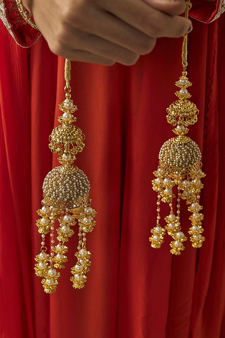 Gold Finish Kundan Polki & Pearl Strand Tying Kaleeras (Set Of 2) by Vivinia By Vidhi Mehra at Pernia's Pop Up Shop