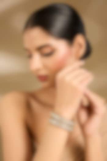 Gold Finish Kundan Polki Bangles (Set Of 2) by Vivinia By Vidhi Mehra at Pernia's Pop Up Shop