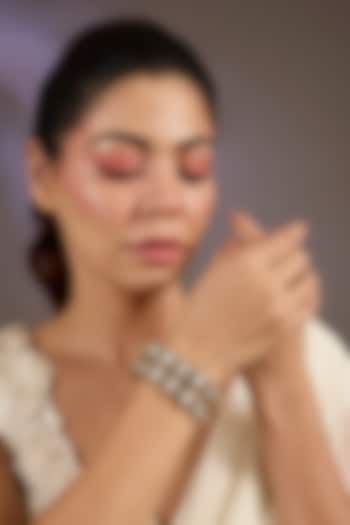 Antique Gold Finish Kundan Polki & Shimmering Stone Bangles (Set Of 2) by Vivinia By Vidhi Mehra at Pernia's Pop Up Shop