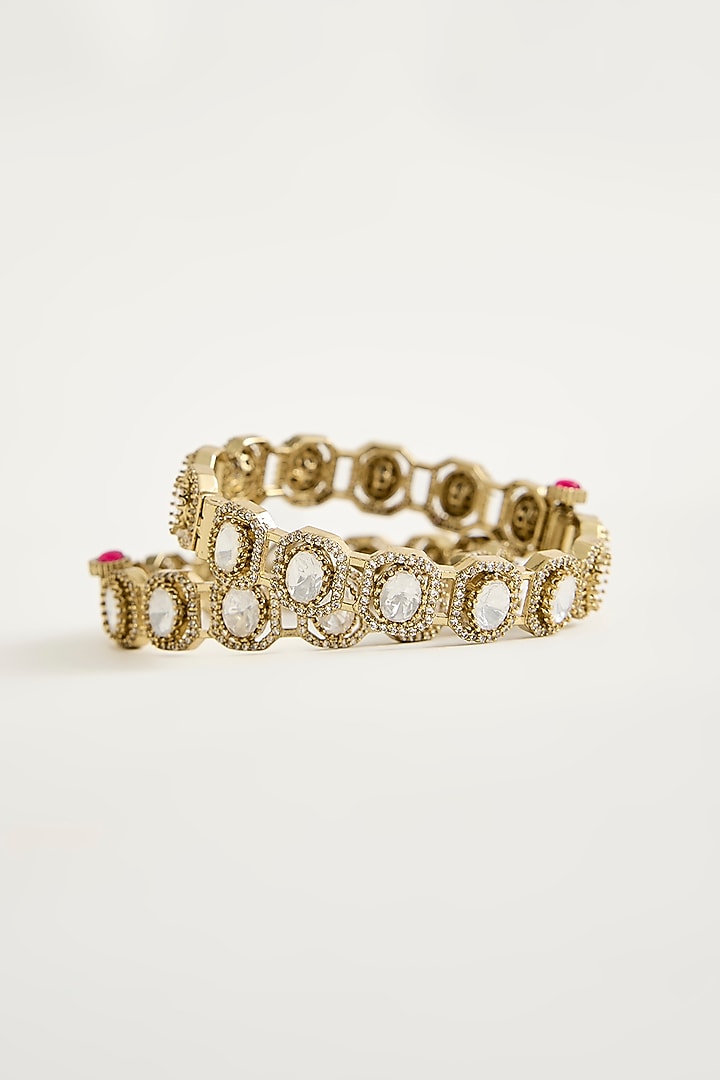 Antique Gold Finish Kundan Polki & Shimmering Stone Bangles (Set Of 2) by Vivinia By Vidhi Mehra at Pernia's Pop Up Shop