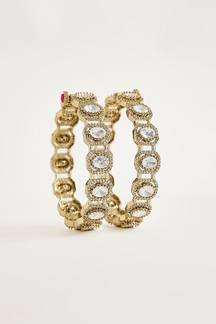 Antique Gold Finish Kundan Polki & Shimmering Stone Bangles (Set Of 2) by Vivinia By Vidhi Mehra at Pernia's Pop Up Shop