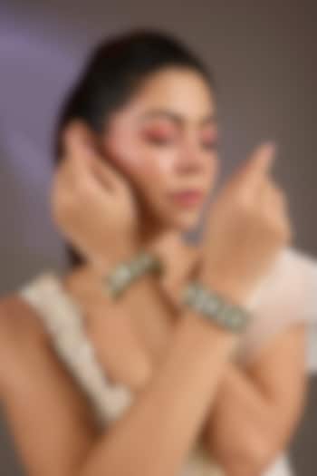 Gold Finish Kundan Polki & Green Stone Bangles (Set Of 2) by Vivinia By Vidhi Mehra at Pernia's Pop Up Shop