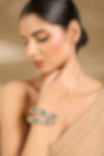 Gold Finish Kundan Polki & Green Stone Bangles (Set Of 2) by Vivinia By Vidhi Mehra at Pernia's Pop Up Shop