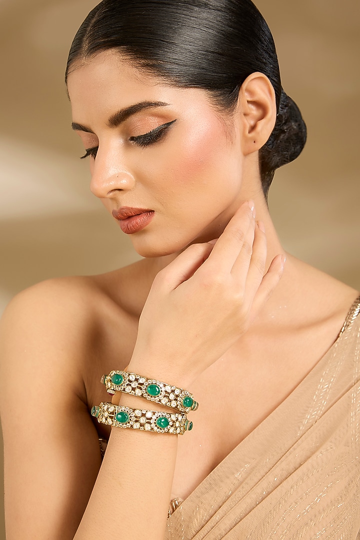 Gold Finish Kundan Polki & Green Stone Bangles (Set Of 2) by Vivinia By Vidhi Mehra at Pernia's Pop Up Shop