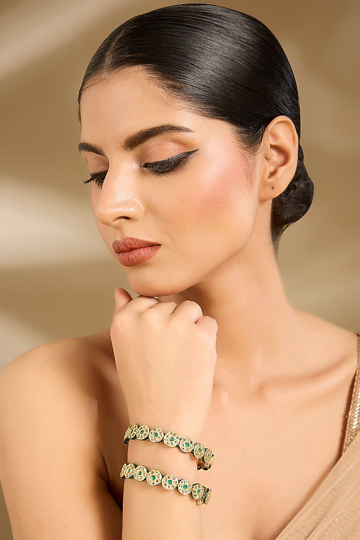 Gold Finish Pearl & Green Stone Bangles (Set Of 2) by Vivinia By Vidhi Mehra at Pernia's Pop Up Shop