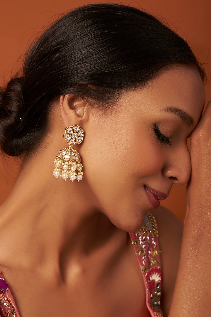Gold Finish Kundan & Pearl Jhumka Earrings by Vivinia By Vidhi Mehra at Pernia's Pop Up Shop