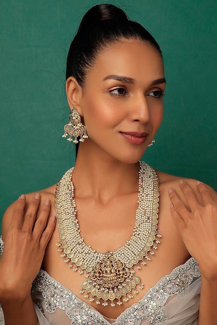 Gold Finish Long Temple Necklace Set With Pearls by Vivinia By Vidhi Mehra