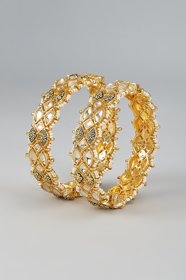 Gold Finish Kundan Polki & Beaded Meenakari Bangles (Set Of 2) by Vivinia By Vidhi Mehra at Pernia's Pop Up Shop
