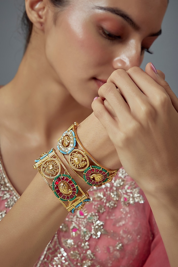 Gold Finish Kundan Polki Bangles (Set Of 2) by Vivinia By Vidhi Mehra at Pernia's Pop Up Shop