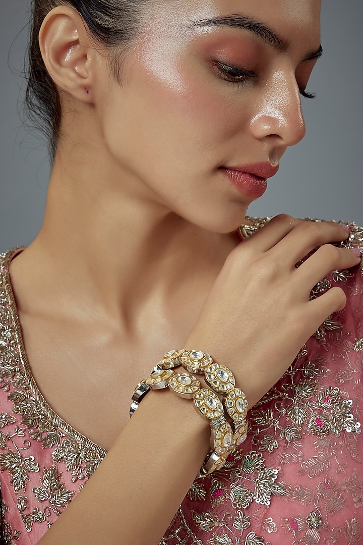 Gold Finish Kundan Polki Bangles (Set Of 2) by Vivinia By Vidhi Mehra at Pernia's Pop Up Shop