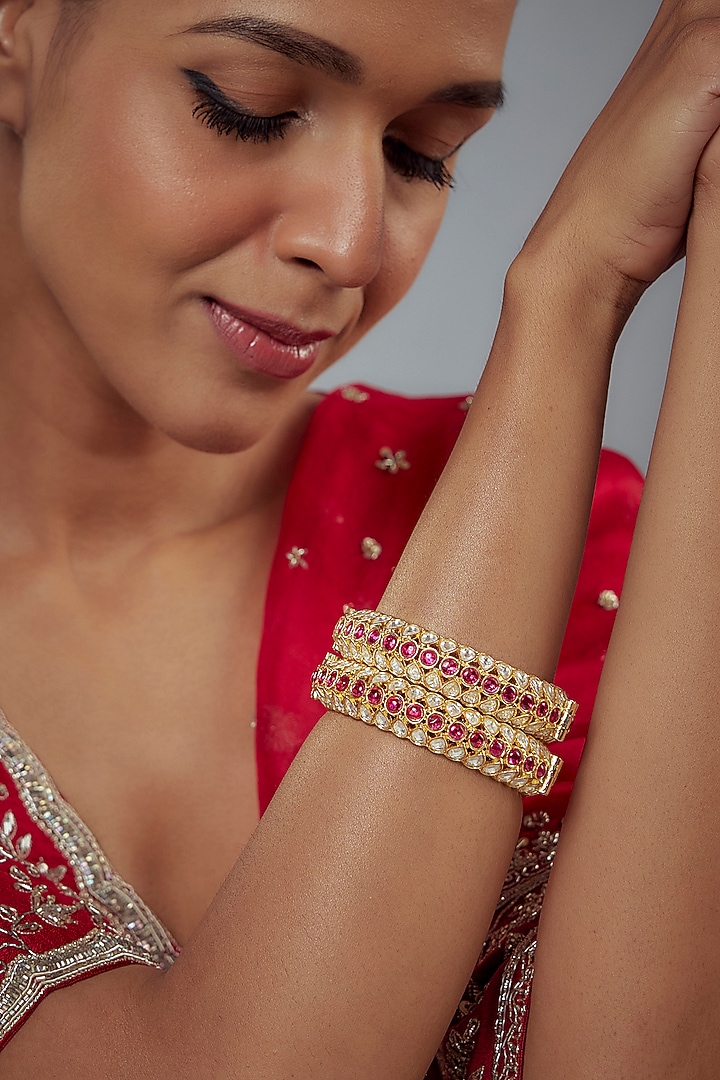 Gold Finish Kundan Polki Bangles (Set Of 2) by Vivinia By Vidhi Mehra at Pernia's Pop Up Shop