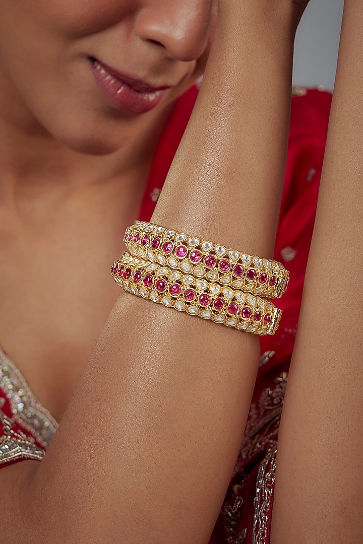 Gold Finish Kundan Polki Bangles (Set Of 2) by Vivinia By Vidhi Mehra at Pernia's Pop Up Shop