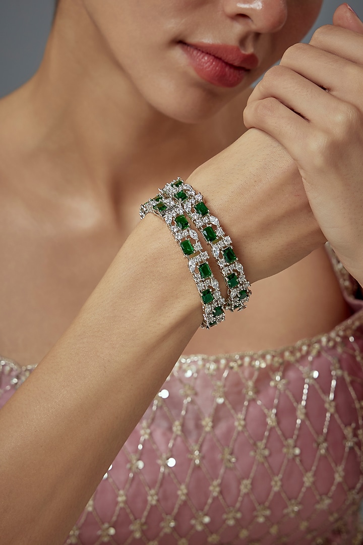 White Finish Green Zircon Bangles (Set Of 2) by Vivinia By Vidhi Mehra at Pernia's Pop Up Shop