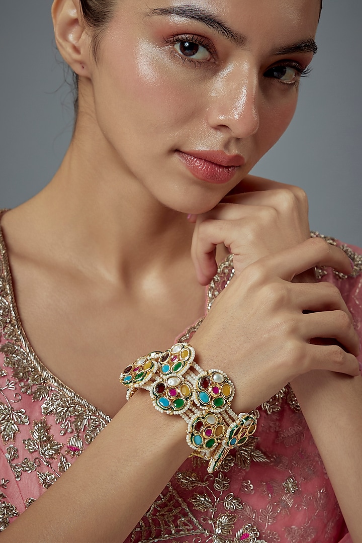 Gold Finish Kundan Polki Bangles (Set Of 2) by Vivinia By Vidhi Mehra at Pernia's Pop Up Shop