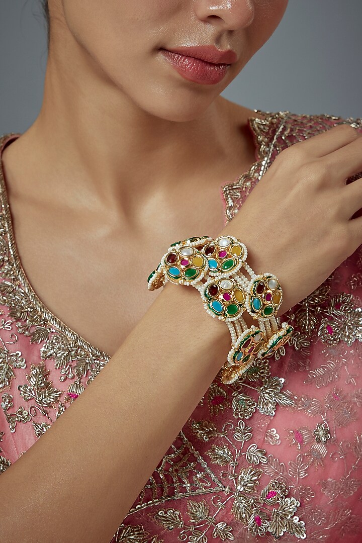 Gold Finish Kundan Polki Bangles (Set Of 2) by Vivinia By Vidhi Mehra at Pernia's Pop Up Shop
