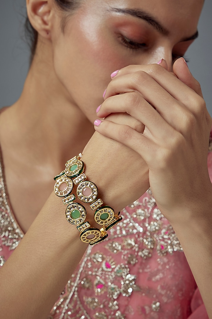 Gold Finish Kundan Polki Bangles (Set Of 2) by Vivinia By Vidhi Mehra at Pernia's Pop Up Shop