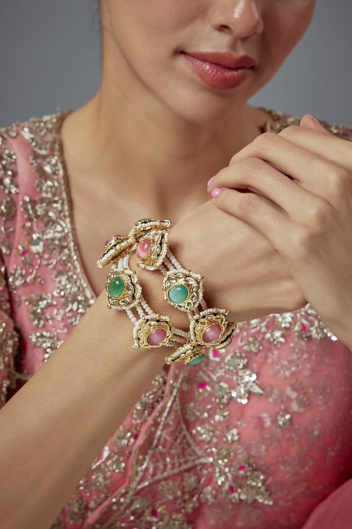 Gold Finish Kundan Polki Bangles (Set Of 2) by Vivinia By Vidhi Mehra at Pernia's Pop Up Shop