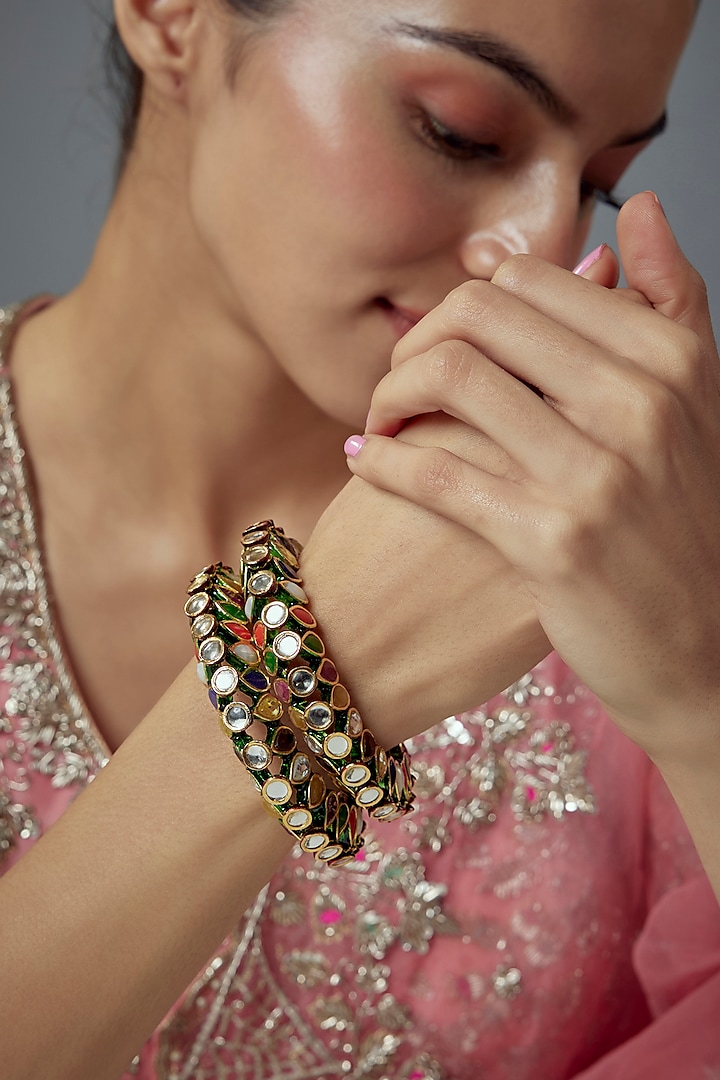 Gold Finish Kundan Polki Bangles (Set Of 2) by Vivinia By Vidhi Mehra at Pernia's Pop Up Shop