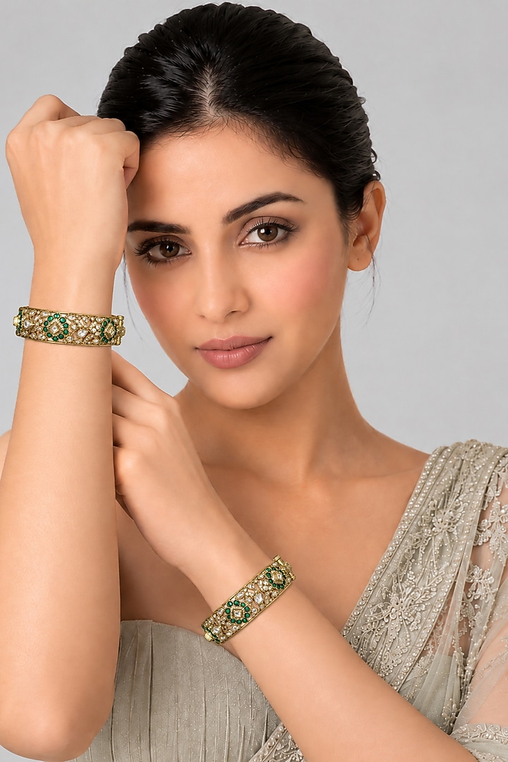 Gold Plated Emerald Stone & Moissanite Polki Floral Bangles (Set Of 2) by Vivinia By Vidhi Mehra at Pernia's Pop Up Shop