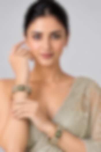 Gold Plated Moissanite Polki & Emerald Stone Floral Bangles (Set Of 2) by Vivinia By Vidhi Mehra at Pernia's Pop Up Shop
